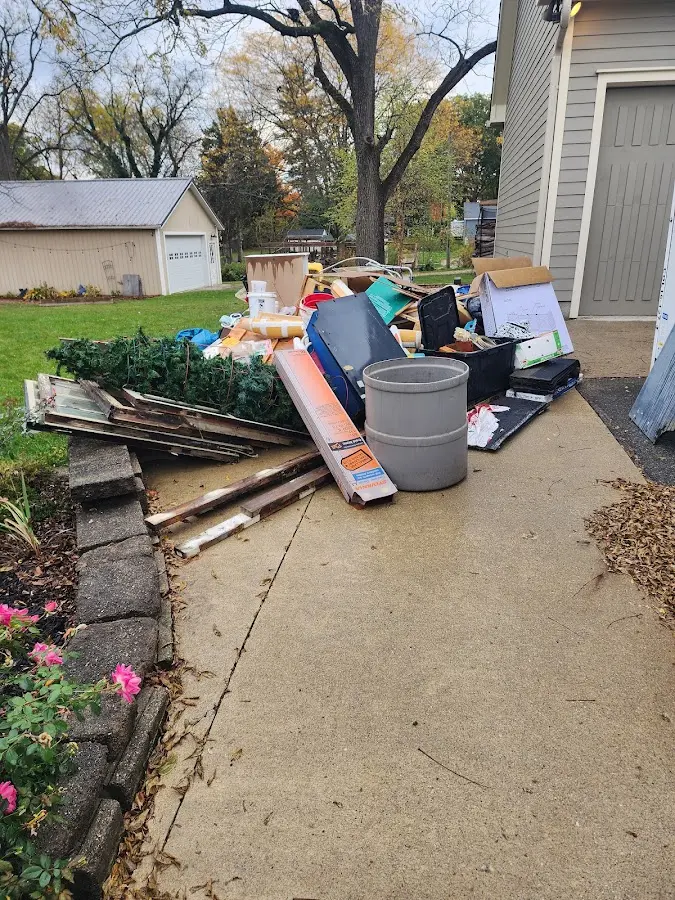 Dumpster being loaded with debris for 10 Yard Dumpster Rental in Lower Paxton